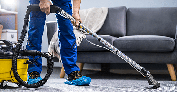 Person Cleaning Carpet